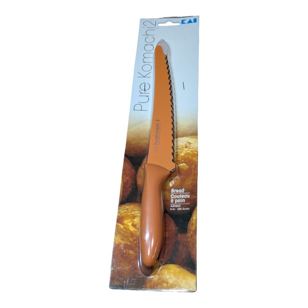 Kai Pure Komachi 2 series 8-inch serrated bread knife in orange.